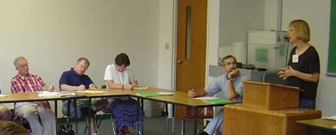 mctc05 L to R: John Lapp, Drew Christiansen SJ, Margaret Pfeil, Earl Zimmerman, Nancy Heisey (speaking)