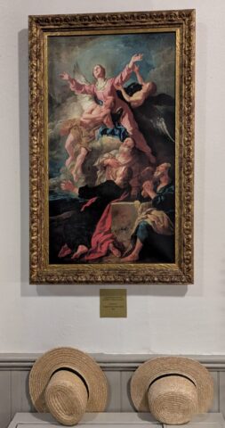 Baroque Catholic painting, near straw hats owned by Amish or Old-Order Mennonites.